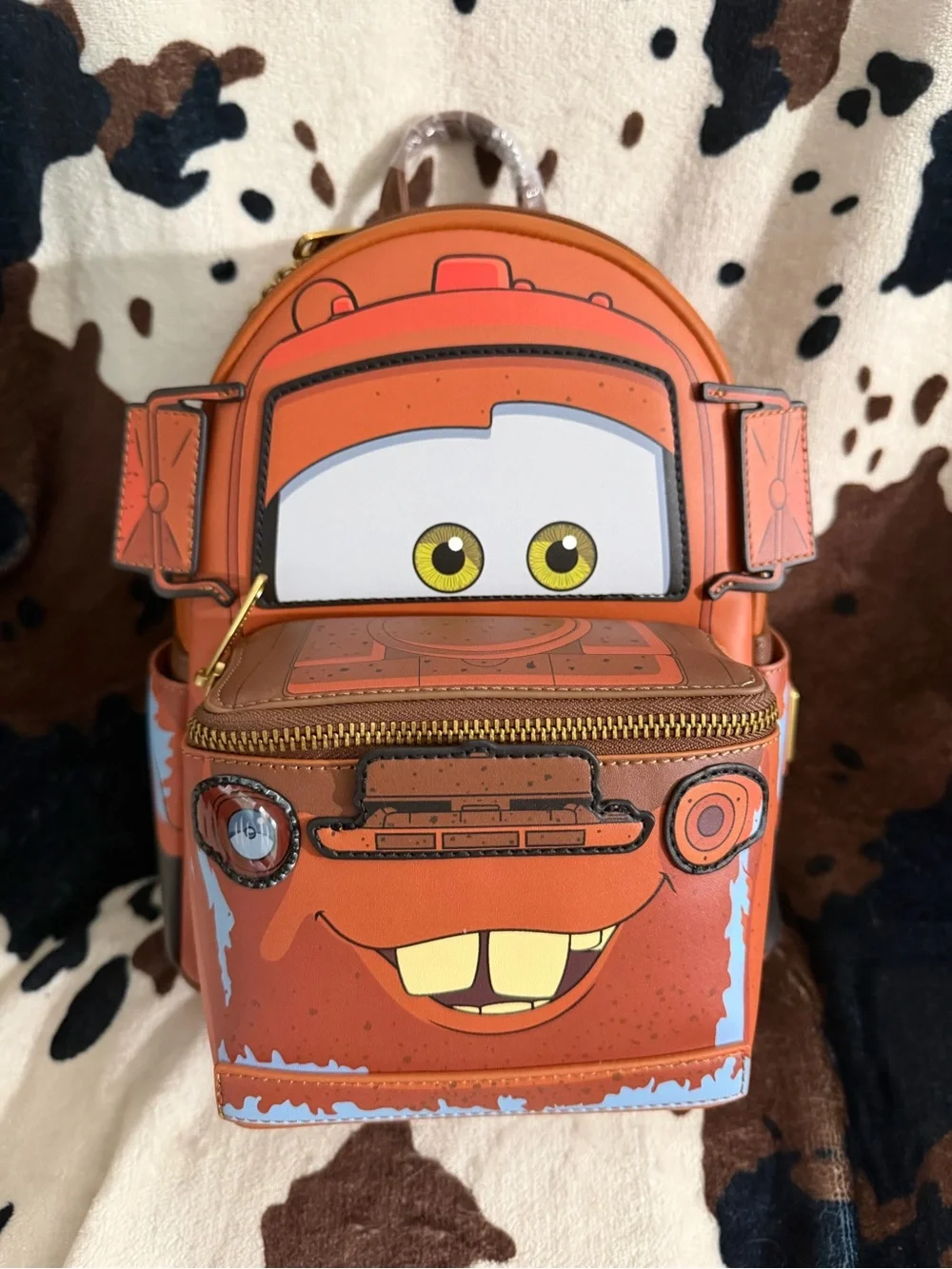 Loungefly Orange Tow Mater Mini Backpack with Character Face
